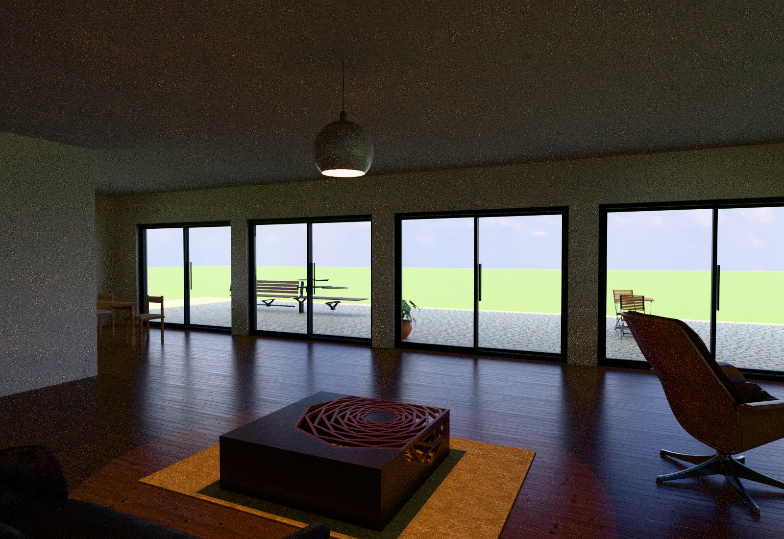 The living room: timber floor, lounge chair and coffee table, with sliding doors onto the terrace